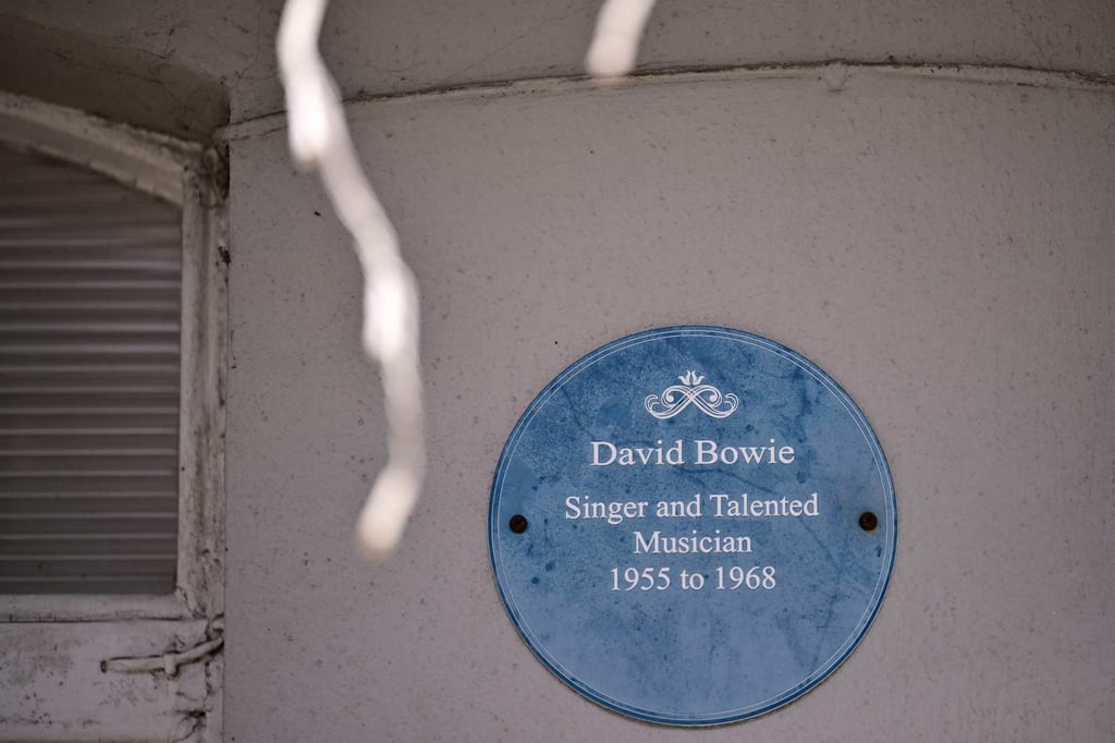 A blue plaque is fixed to the wall next to the front door of David Bowie’s former home. Photo: AFP