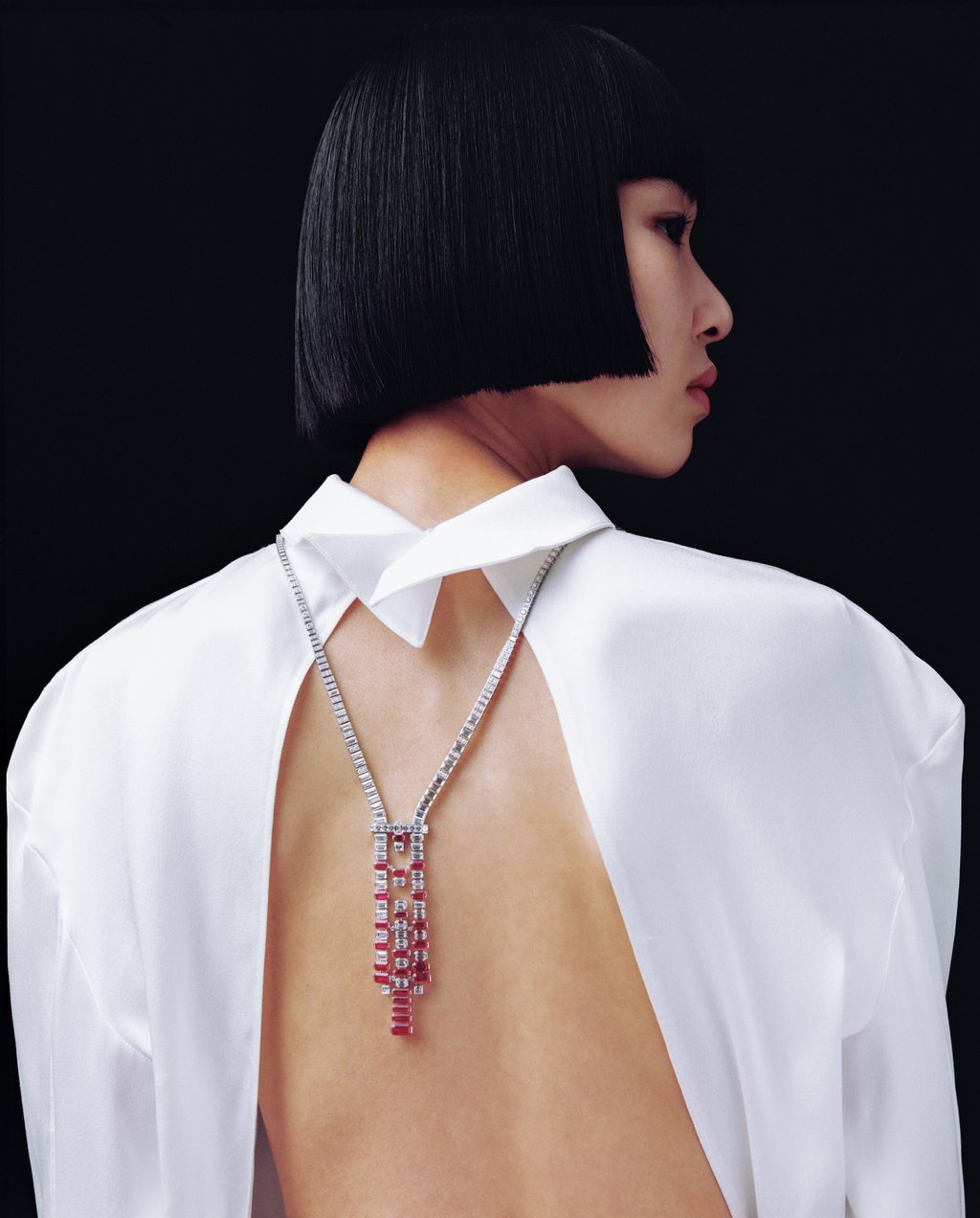 Necklace: Cartier. Blouse: Louis Vuitton