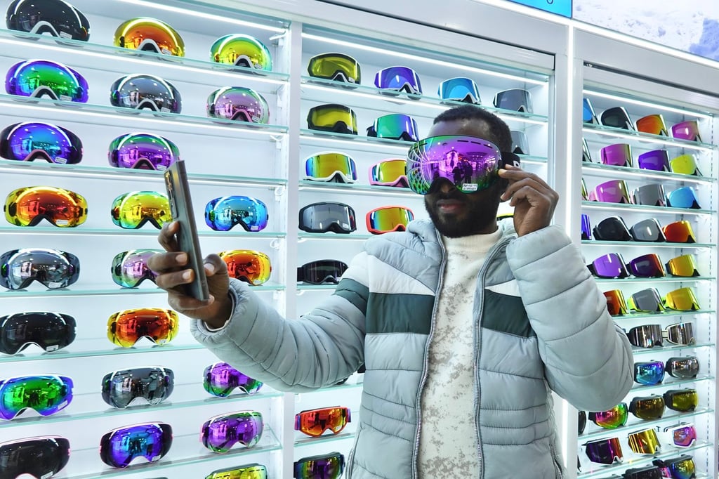 A foreign buyer tries on ski goggles in Yiwu, December 13, 2025. Photo: China News Service/VCG via Getty Images