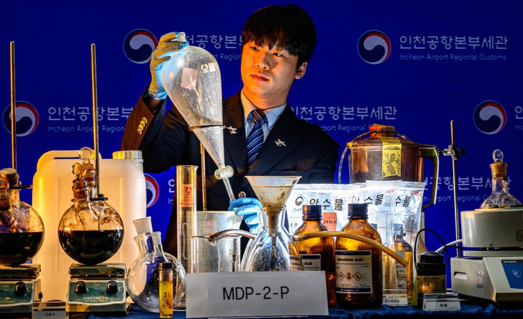 A customs official shows methamphetamine manufacturing equipment seized at Incheon International Airport. Photo: The Korea Times