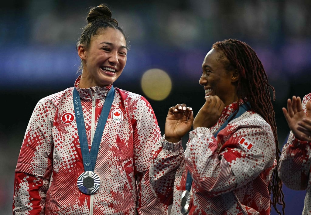Charity Williams (right) and teammate Florence Symonds share a moment after winning the silver medal at the Paris Olympics. Photo: AFP