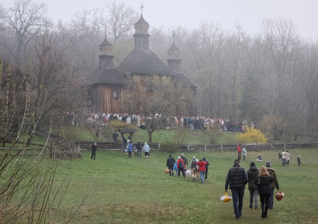 People carry Easter baskets in Kyiv on Sunday. Photo: Reuters