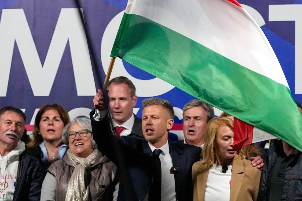Peter Magyar, the leader of the opposition Tisza party, waves a national flag during a rally in Debrecen, Hungary, on Saturday. Photo: AP