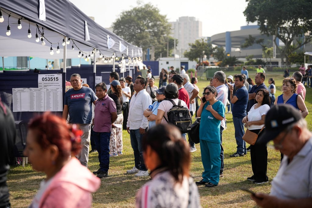 People wait in a queue to vote in Lima. Photo: Reuters People wait in a queue to vote in Lima. Photo: Reuters