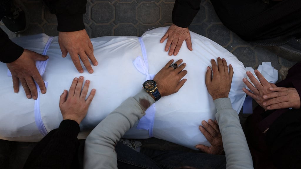 Mourners attend the funeral of two Palestinians in Gaza who doctors said died on Thursday in an Israeli strike. Photo: Reuters Mourners attend the funeral of two Palestinians in Gaza who doctors said died on Thursday in an Israeli strike. Photo: Reuters