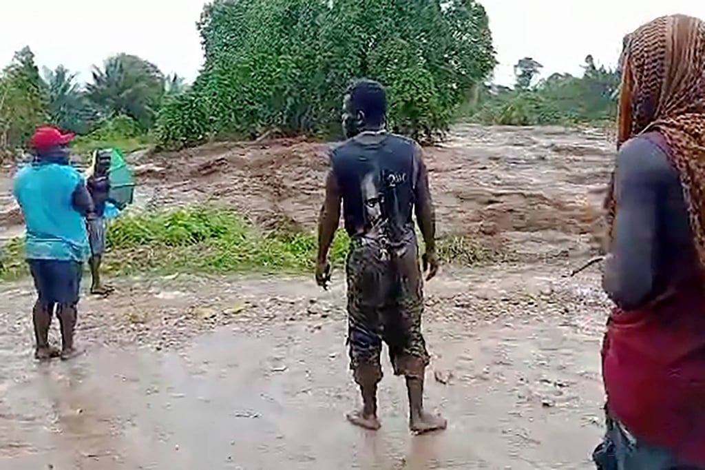 Locals look at floodwaters from the Ramazon River in Papua New Guinea due to heavy rains from tropical cyclone Maila. Photo: AFP Locals look at floodwaters from the Ramazon River in Papua New Guinea due to heavy rains from tropical cyclone Maila. Photo: AFP