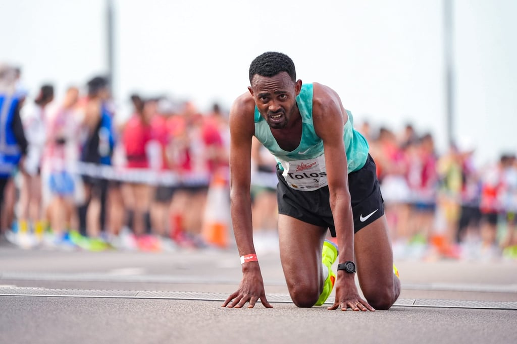 Ethiopia’s Milkesa Mengesha takes a knee after winning last year’s race. Photo: Eugene Lee Ethiopia’s Milkesa Mengesha takes a knee after winning last year’s race. Photo: Eugene Lee