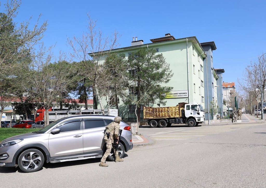 A special security force surrounds the school while students are being evacuated to southeastern Turkey. Photo: AFP/DHA