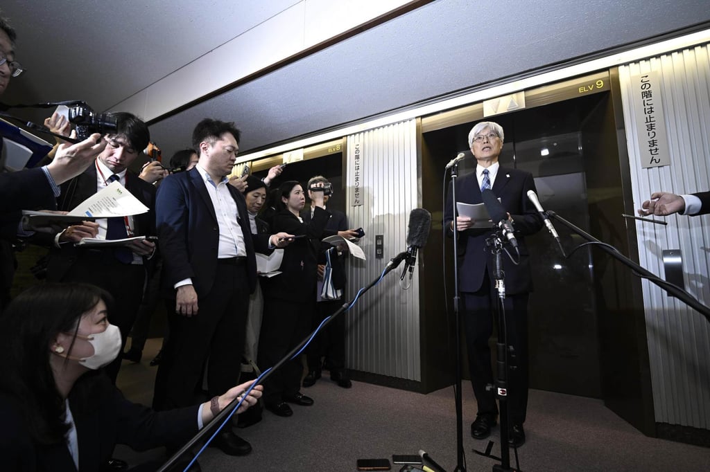 Naoki Fujii (right), president of Narita International Airport, speaks to reporters in Tokyo on April 2. Photo: Kyodo