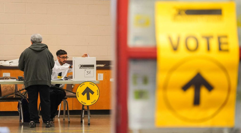 A person casts their vote at a polling station in Toronto. Photo: AFP A person casts their vote at a polling station in Toronto. Photo: AFP