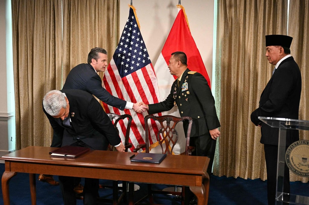 US Defense Secretary Pete Hegseth shakes hands with Indonesia's Director General of Defense Strategies Major General Agus Widodo at the Pentagon on Monday as Indonesian Defense Minister Sjafrie Sjamsoeddin (right) looks on. Photo: AFP