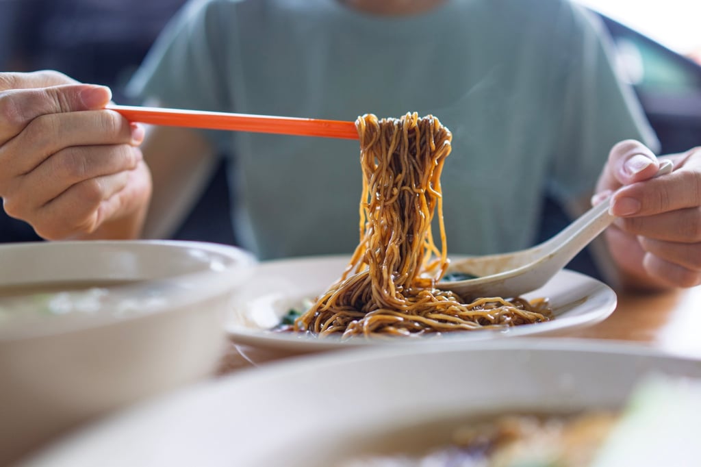 Malaysians typically eat wonton noodles in dark soy sauce, unlike how they are served in Singapore and other parts of Asia. Photo: Getty Images
