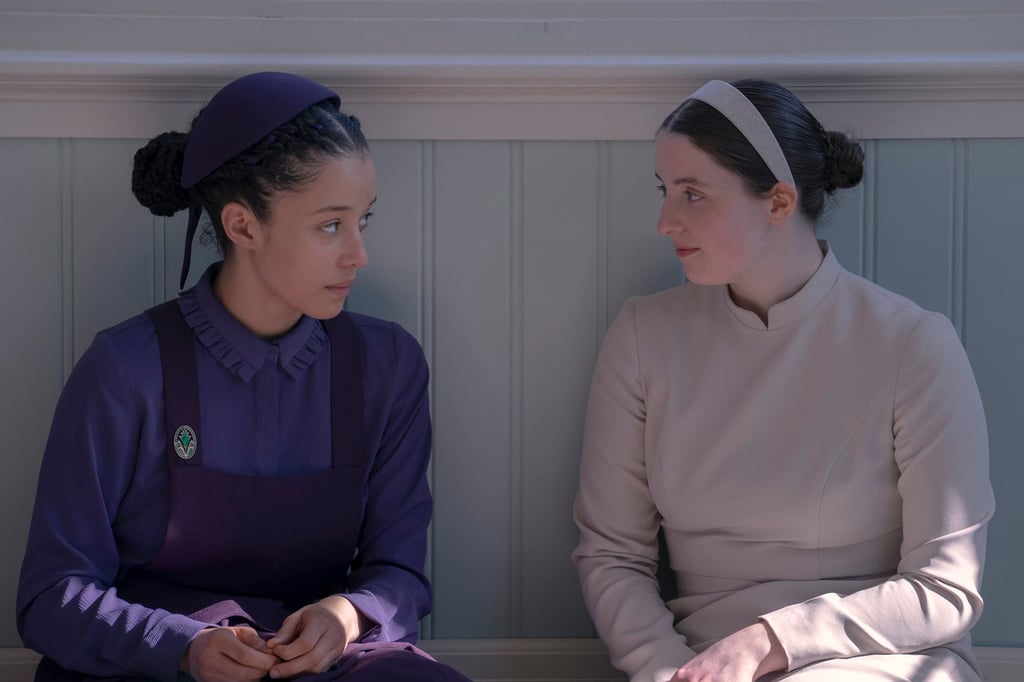 Chase Infiniti (left) and Lucy Halliday star in The Testaments. Photo: Disney/TNS