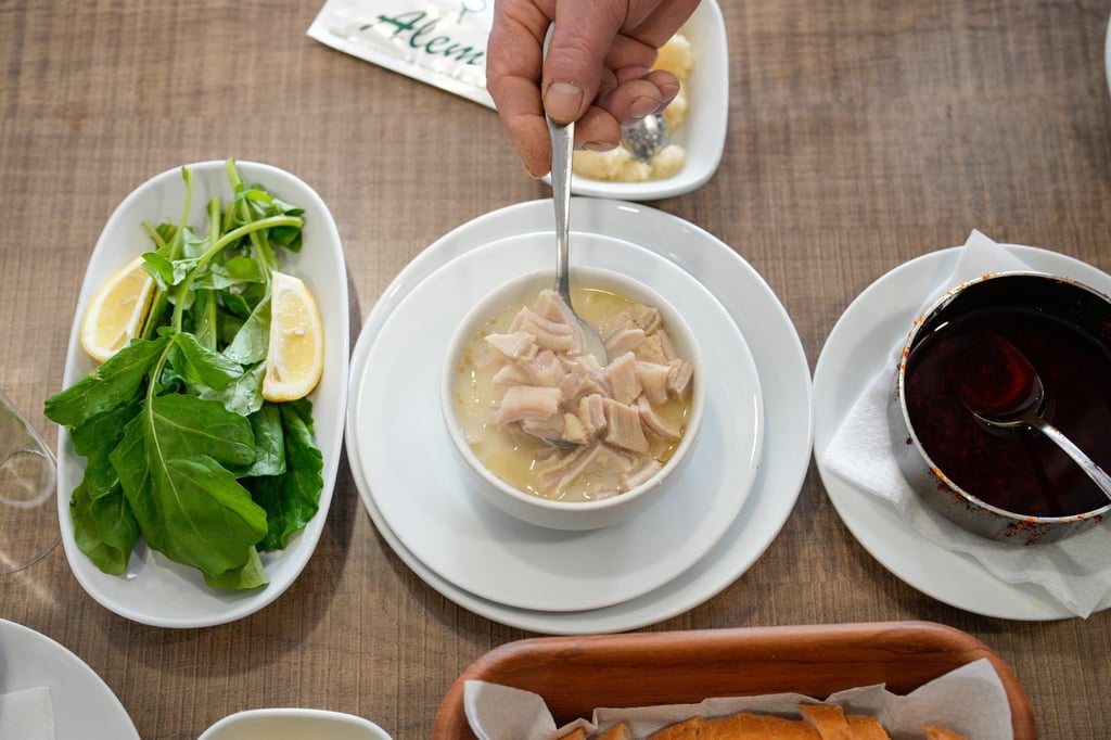 Traditional tripe soup is served with other dishes at a restaurant in Istanbul, Turkey. Photo: AP