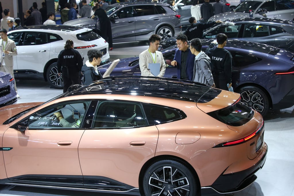 People check out cars at an auto show in Jinan, Shandong province, on April 10. Photo: Xinhua