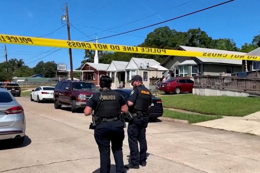 Police secure the street where the children were killed. Photo: KTBS via Reuters