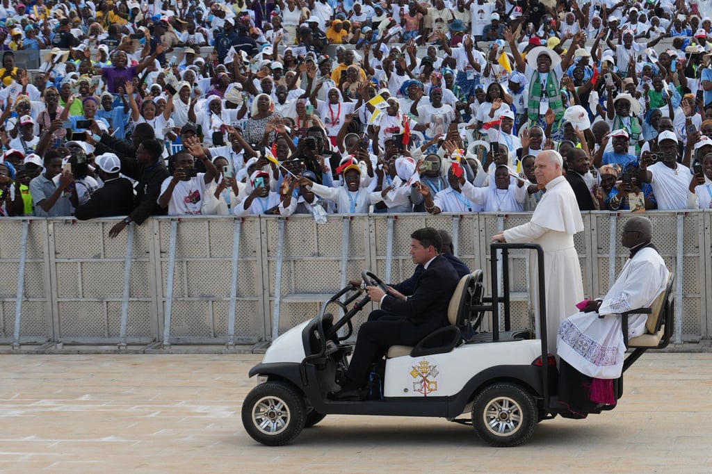 Pope Leo arrives at the esplanade in front of the Sanctuary of Mama Muxima. Photo: AP