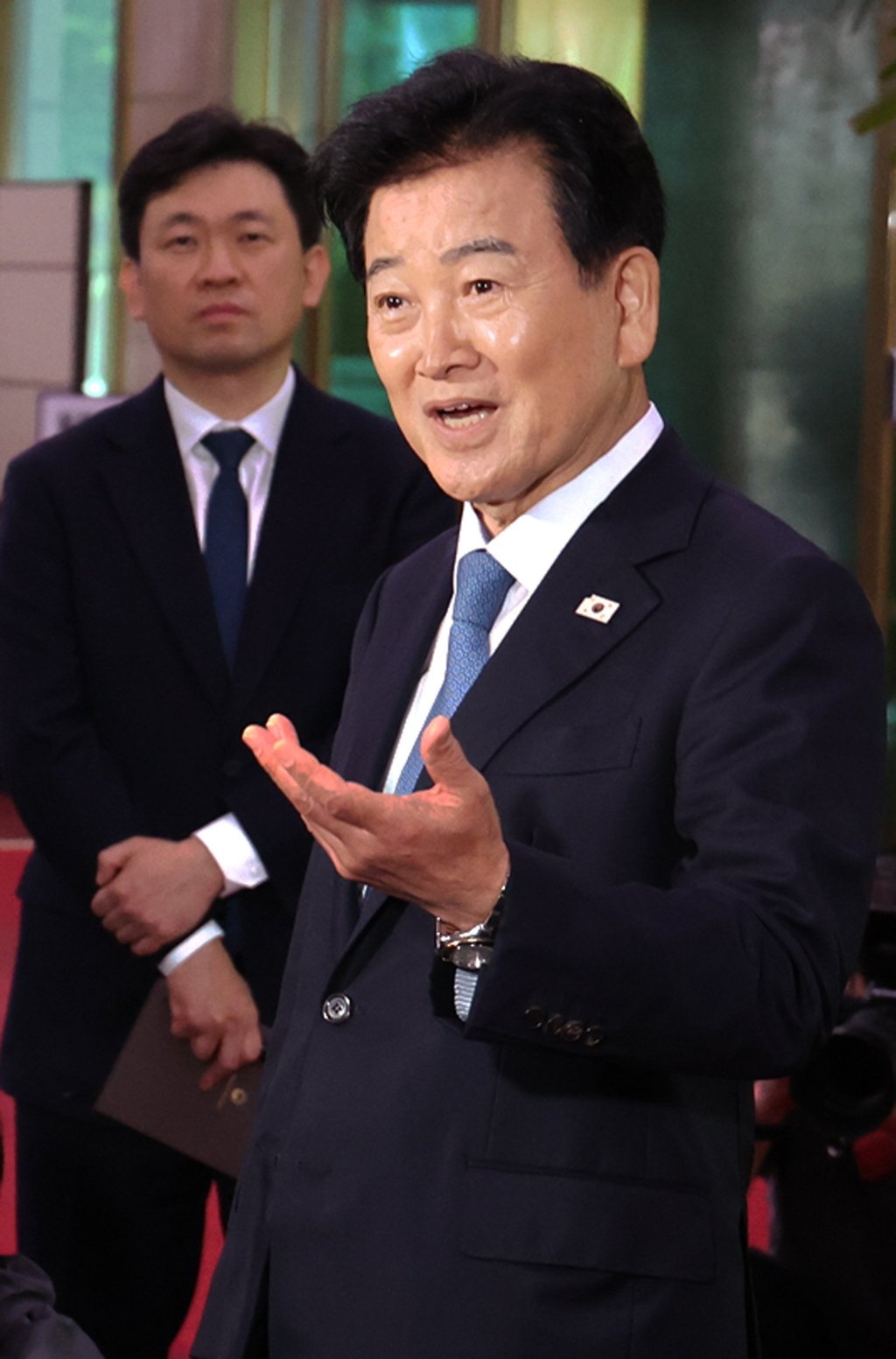 Unification Minister Chung Dong-young (right) speaks to reporters at the government complex in Seoul, South Korea, on Monday. Photo: EPA/Yonhap