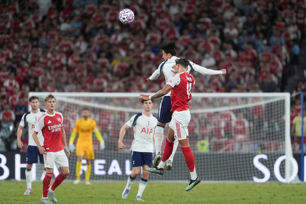 Tottenham Hotspur’s Son Heung-min outjumps Arsenal’s Ben White during their friendly at Kai Tak Stadium. Photo: Elson Li