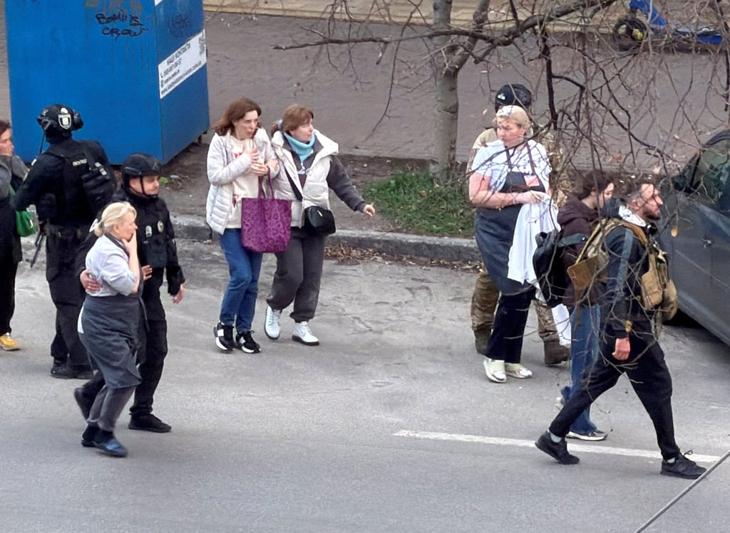 Police evacuate hostages in Kyiv on Saturday. Photo: Reuters
