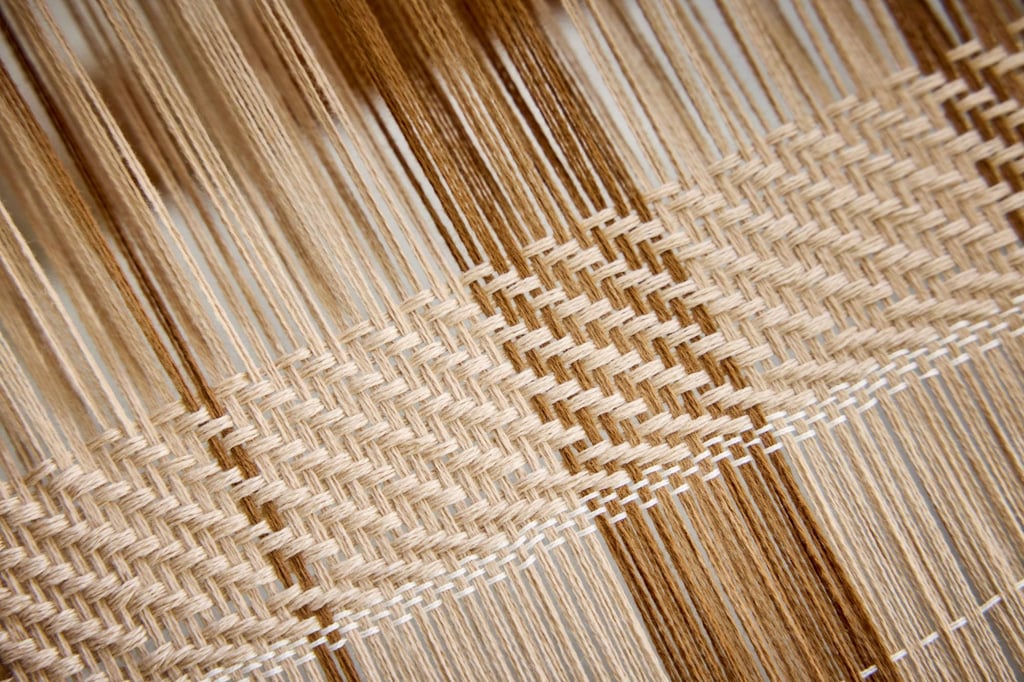 Loro Piana’s Milan Design Week 2026 exhibition explores the brand’s use of plaid patterns and techniques. Photo: Handout