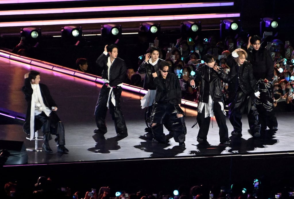 BTS performs onstage during a comeback concert at Gwanghwamun Square on March 21. The K-pop boy band is managed by Bang’s Hybe. Photo: Reuters