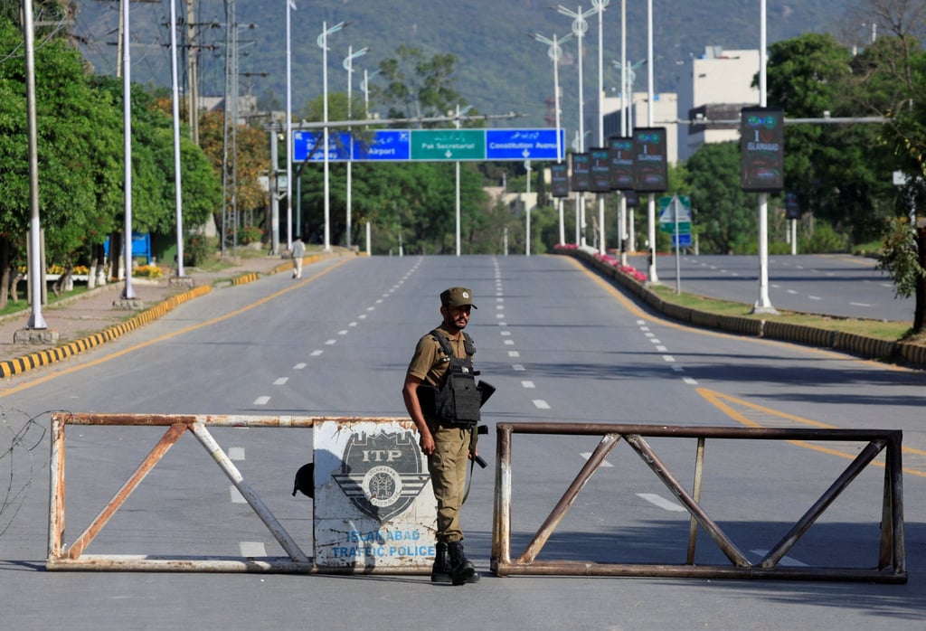 A Pakistani soldier stands guard on a road leading to the Serena hotel in Islamabad, the venue for talks. Photo: Reuters