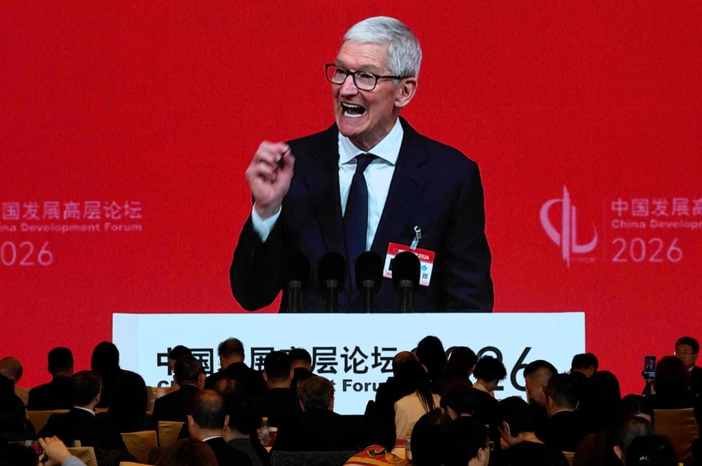 Apple CEO Tim Cook is seen on a big screen in a live broadcast of his speech at the opening of the China Development Forum, Beijing, on March 22, 2026. Photo: Pool/AFP