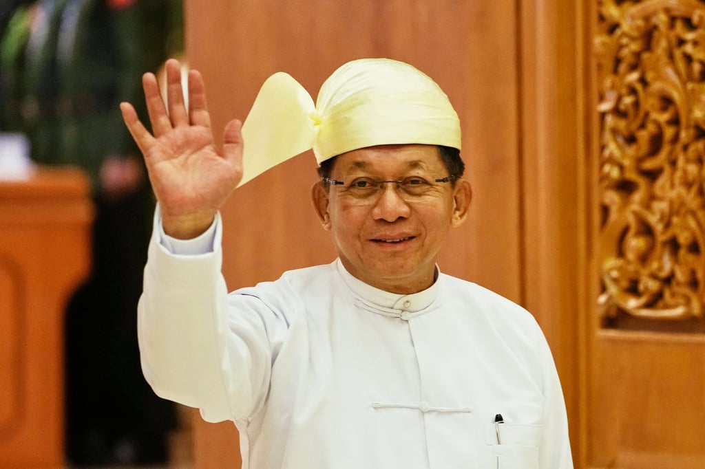 Former junta chief Min Aung Hlaing waves as he leaves parliament in Naypyidaw after being sworn in as Myanmar’s next president on April 10. Photo: AP