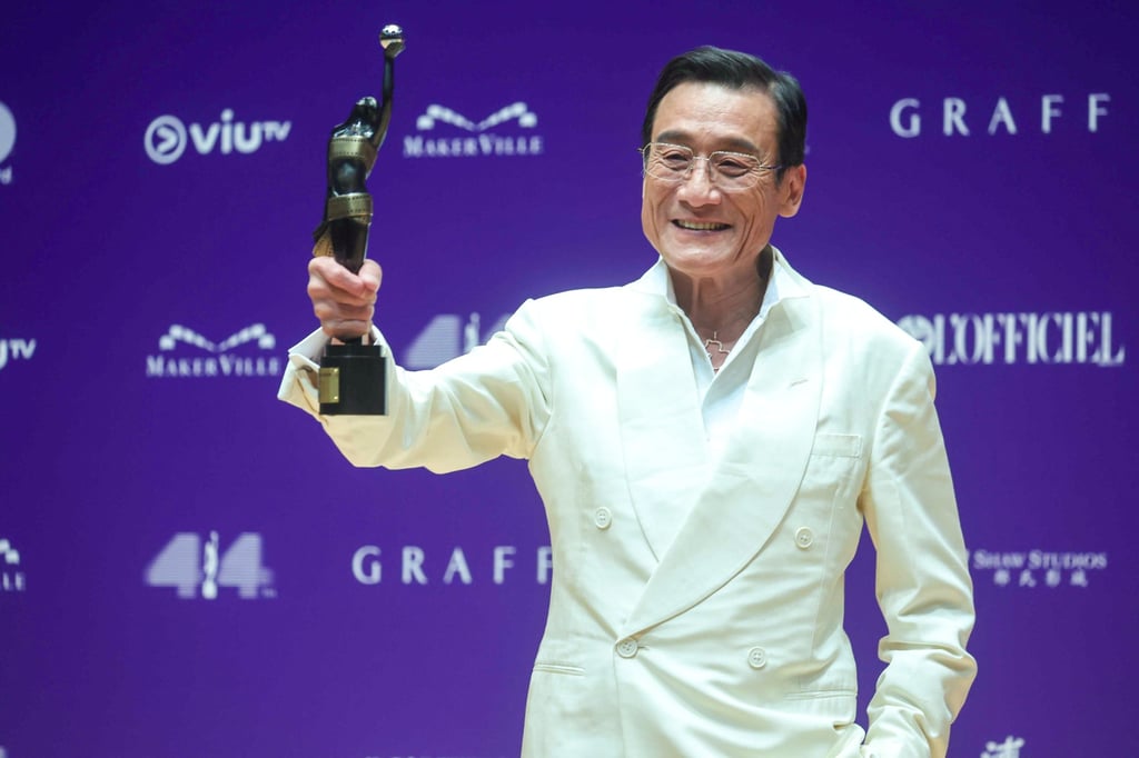 Tony Leung holds up his best actor trophy for The Shadow’s Edge at the 44th Hong Kong Film Awards on April 19. Photo: Edmond So