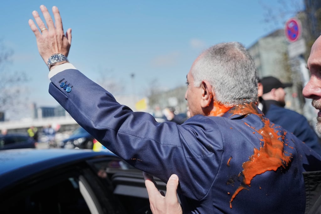 Reza Pahlavi waves to supporters after the attack. Photo: AP
