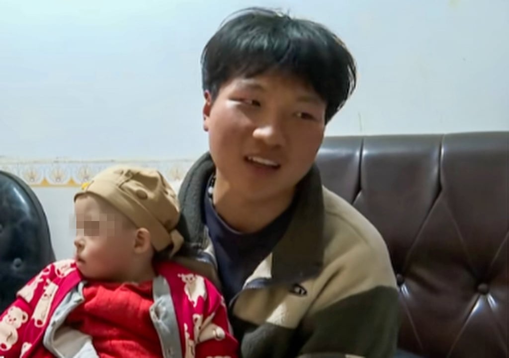 Sun Pan, above, who is said to work 18 hours a day, holds his baby brother. Photo: Douyin
