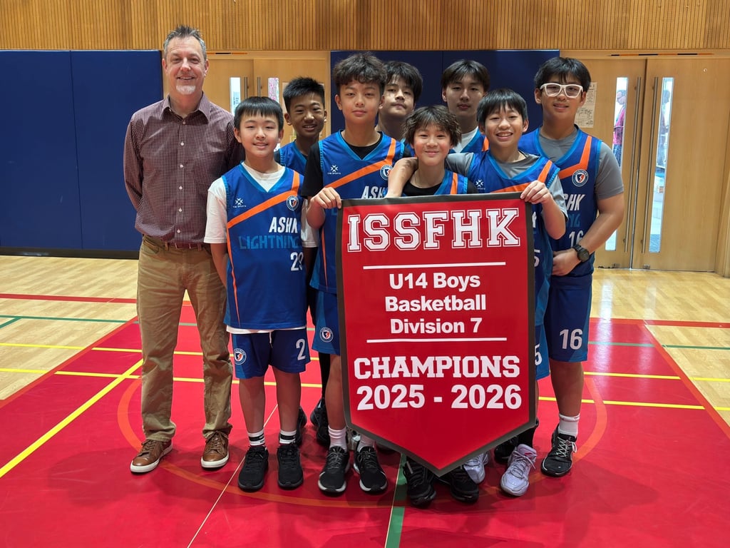 American School Hong Kong students proudly display their U14 Boys Basketball Championship banner. Photo: Handout