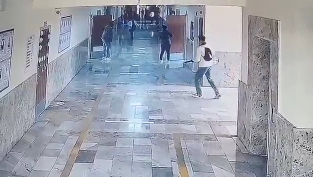 An armed person walks down a school corridor in Siverek, Sanliurfa province in Turkey on April 14, 2026, in this still image obtained from a social media video. Photo: via Reuters