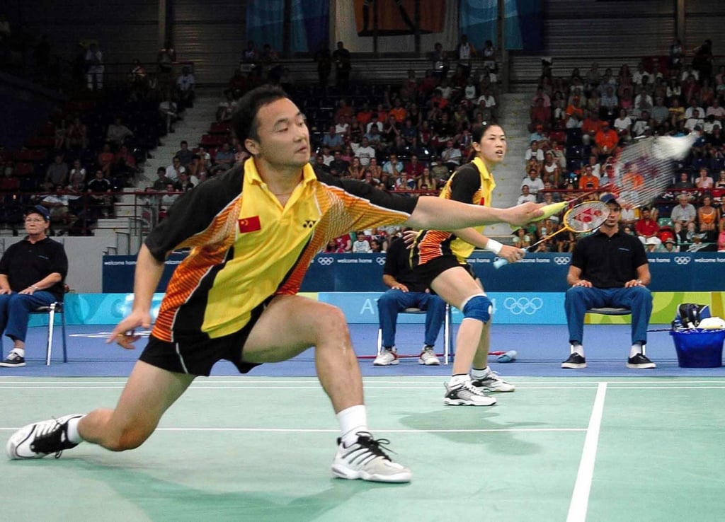 Zhang Jun (left) and his partner Gao Ling defended their gold medal in mixed doubles at the 2004 Athens Olympics, Photo: Xinhua