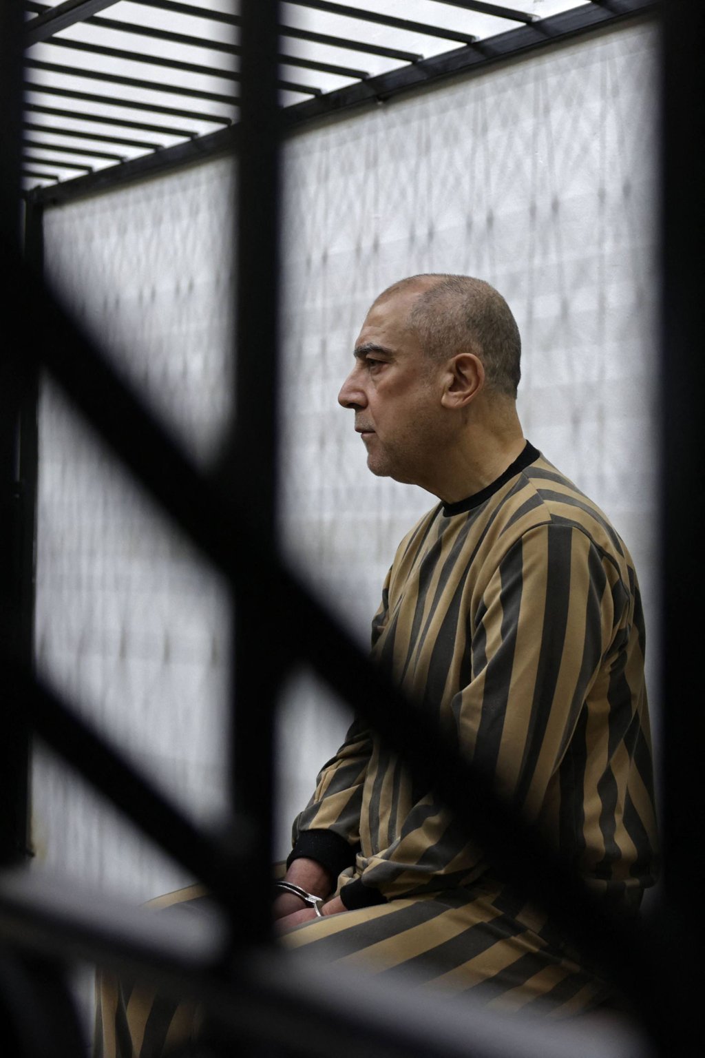 Former head of political security in south Syria’s Daraa province, Atif Najib, attends the first trial session at the Palace of Justice, in Damascus on Sunday. Photo: AFP