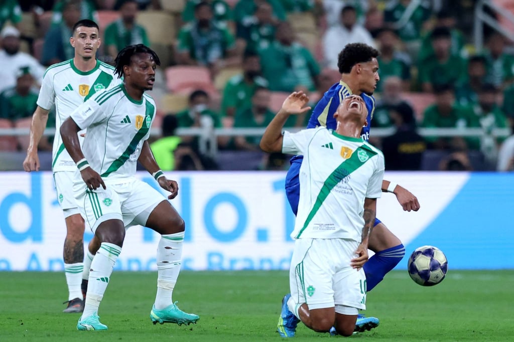 Roberto Firmino of Al-Ahli takes a tumble during his team’s victory over Machida Zelvia. Photo: AFP