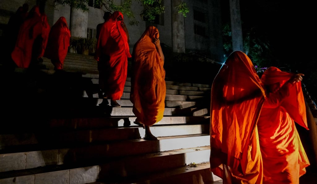 Sri Lankan monks are taken to a detention centre in Colombo after a court hearing in Negombo on Sunday. Photo: AFP