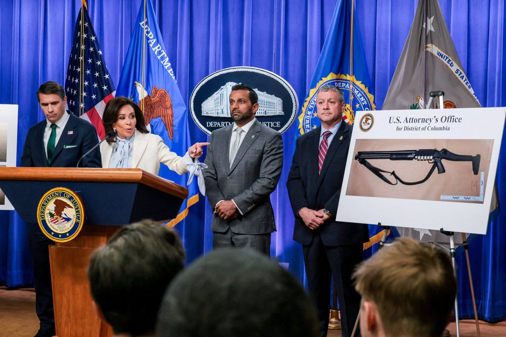 Jeanine Pirro, the US attorney in Washington, points at a picture of a shotgun carried by Cole Tomas Allen. Photo: Reuters