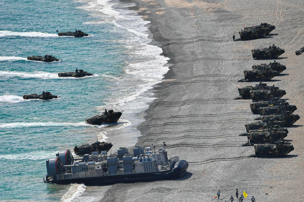 South Korean Marine Corps amphibious assault vehicles and an LSF landing craft carrying Marines moving towards a beach in Pohang, about 270km southeast of Seoul on Sunday. Photo: EPA/Handout