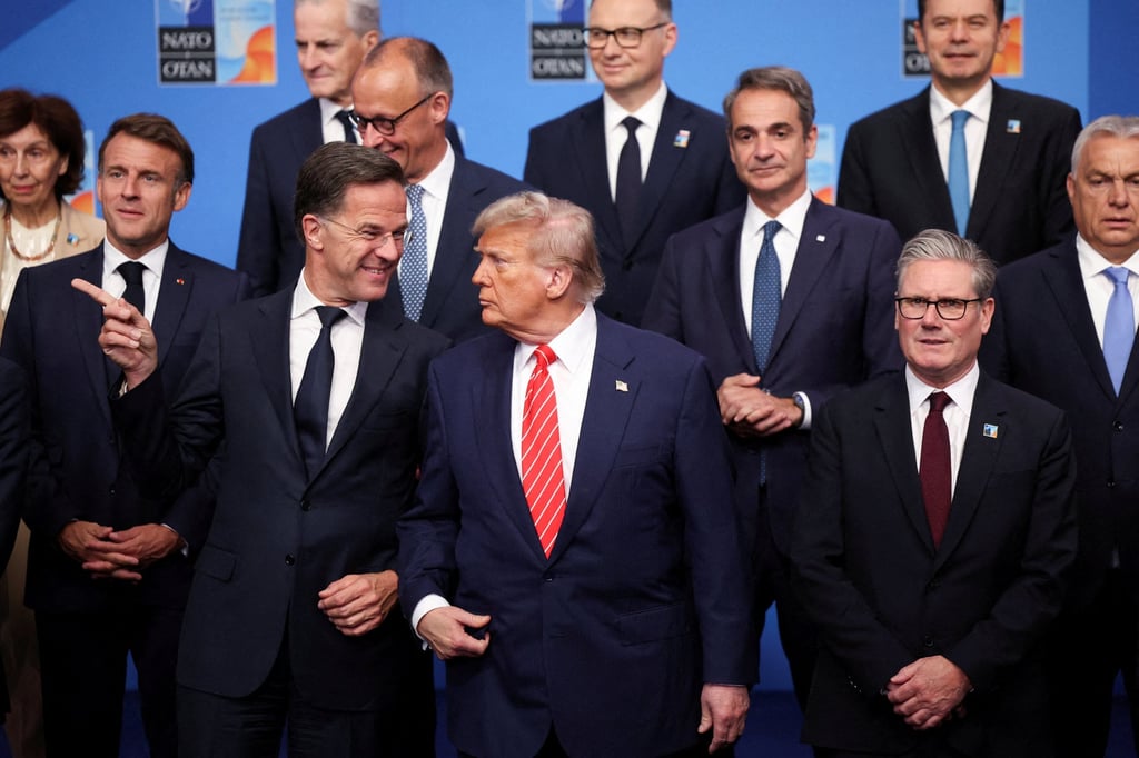 Nato Secretary General Mark Rutte speaks with US President Donald Trump as leaders pose for a family photo at last year’s summit in the Netherlands. Photo: Reuters