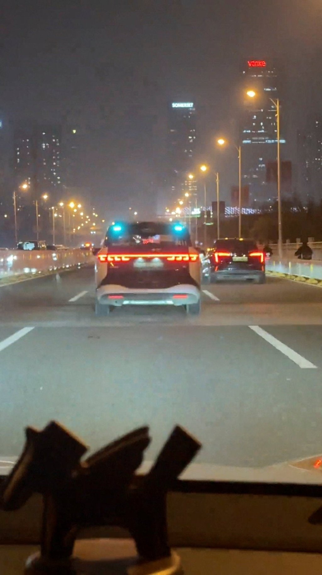 A stranded Apollo Go robotaxi is seen through the windscreen of a car in Wuhan, China, on March 31. Photo: Reuters