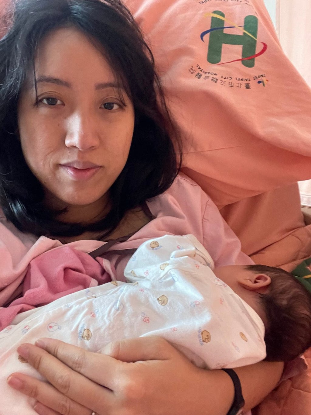 Wei lies in a hospital bed in Taipei, Taiwan, with her newborn baby. She was inspired to write her book Sitting the Month after a negative experience at a confinement hotel following the birth of her first child. Photo: Clarissa Wei