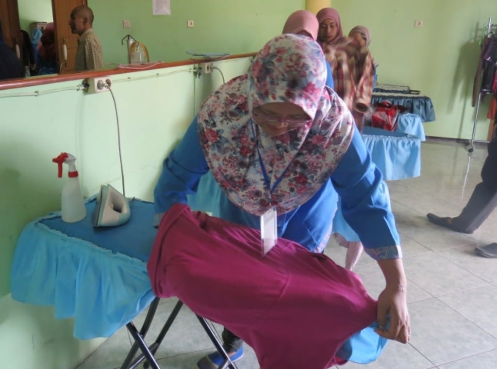 Domestic workers learn ironing skills in Indonesia. Photo: International Labour Organization