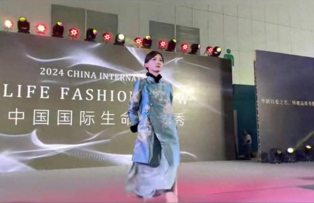 A blue and gold coloured garment being worn at the 2024 China Funeral Technology and Culture Festival in China. Photo: Weibo
