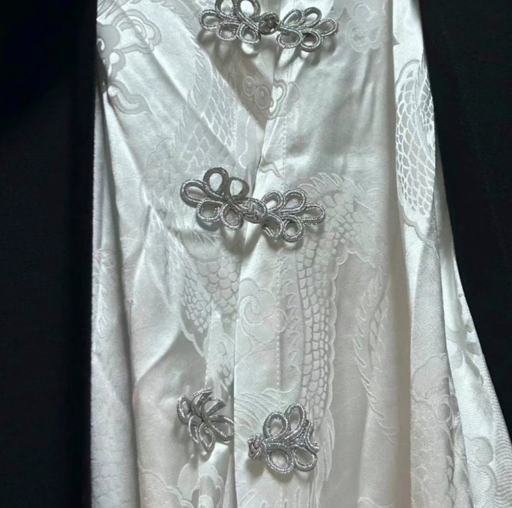 A traditional Chinese white silk top with stylish rope-like buttons, above. Photo: RedNote