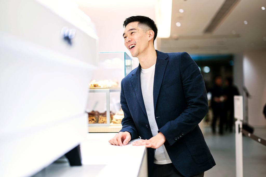 Enzo Cheng leans on the counter in a Noc cafe. Photo: courtesy of Noc