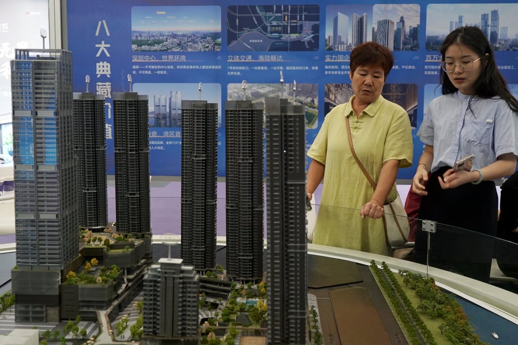 Scale models of residential buildings are displayed at a property fair in Shenzhen. Photo: Reuters
