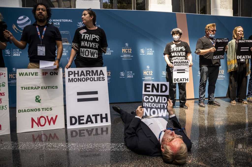 Activists protest at the World Trade Organization headquarters urging governments to demand waivers for Trade-Related Aspects of Intellectual Property Rights (TRIPS) amid the Covid-19 pandemic, in Geneva, Switzerland, on June 15, 2022. Photo: EPA-EFE