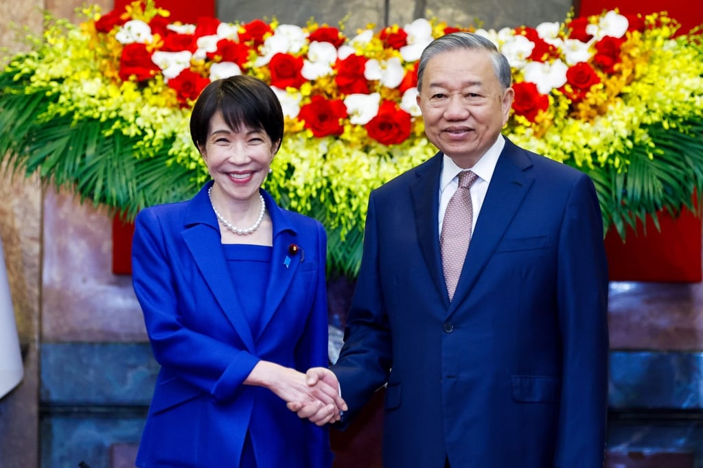 Vietnamese President and General Secretary of the Communist Party To Lam (right) shakes hands with Japanese Prime Minister Sanae Takaichi during their meeting at the Presidential Palace in Hanoi, Vietnam, on Saturday. Photo: EPA